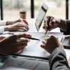 Startup business meeting to analyze and discuss the situation on the financial report in the
